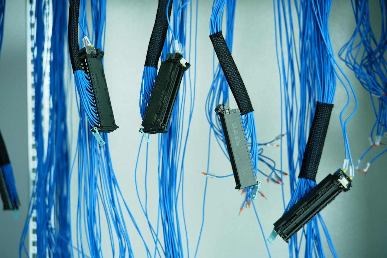 The Art of Drawing Readers In: Your attractive post title goes here Close-up of blue ethernet cables hanging in a data center, highlighting technology connections.